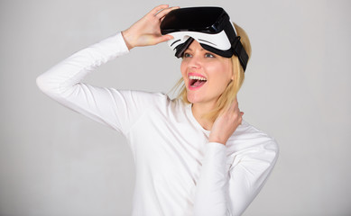 Woman using VR device. Young woman using a virtual reality headset with conceptual network lines. Young woman using a virtual reality headset. Technology, science, innovation and cyberspace concept.