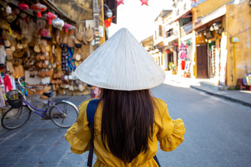 Young Asian Woman traveler with backpack in Hoi An  city in Vietnam