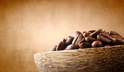 coffee beans in wooden bowl 