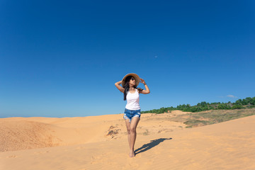 Portrait Young Asian Woman travel, On White Sand dune desert Muine, in Vietnam