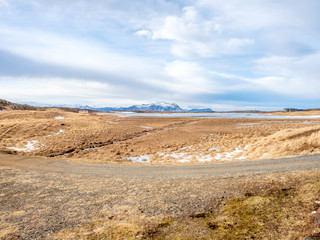 Field with snow in winter season, Iceland