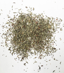 Dry thyme seeds on white background