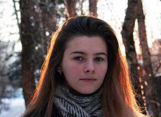 Young woman on front of sun