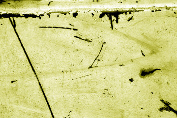 Grungy rusted metal surface in yellow tone.