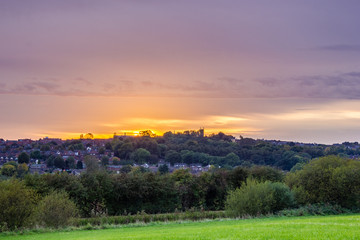 Sunset over the field and village