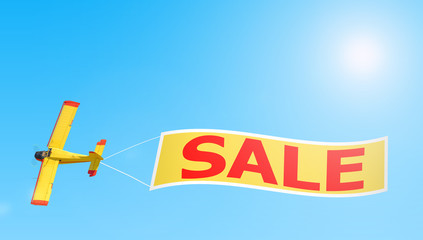 old vintage retro propeller engine airplane flying with sale banner isolated on blue sunny sky air...