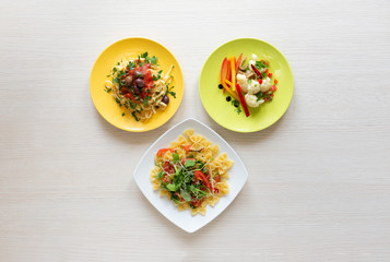 trio of dish of pasta and vegetables