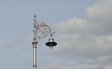 Fototapeta na wymiar Antique street lamp sky background