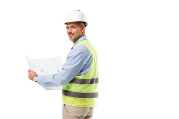 engineer in helmet looking at camera and holding blueprint isolated on white