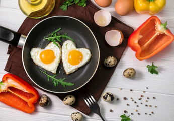 Fried eggs on wooden table