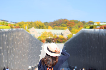 A tourist is traveling in the famous Woman University in South Korea.