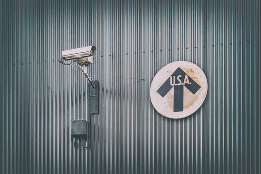 Surveillance camera with vintage USA direction sign