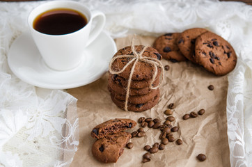coffee cookies with chocolate and a cup of black coffee
