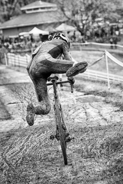 Cyclist competes in muddy race