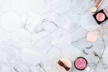 make up cosmetic flat lay top view on the tile marble white color look clean with copy space for text