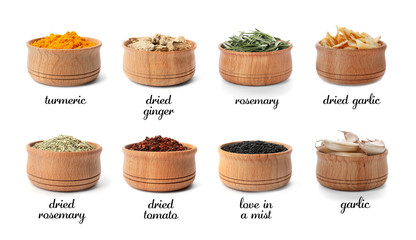 Wooden bowls with different spices and herbs on white background. Large collection with names