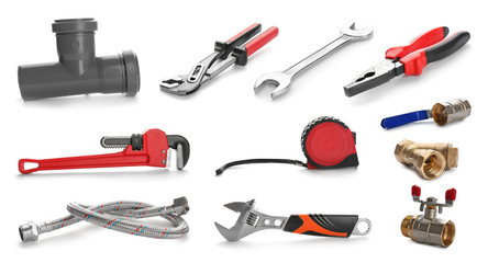 Set of different tools and fittings on white background. Plumber service