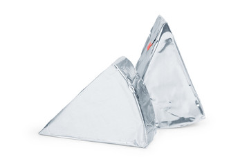 Cream cheese in triangle shape isolated on white