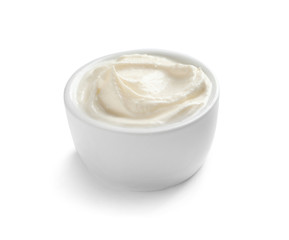 Obraz na płótnie Canvas Bowl of tasty cream cheese on white background
