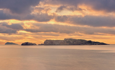 A golden sunrise in the sea of Ibiza