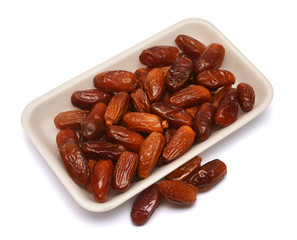 Dates are in the package isolated on a white background. Flat lay, top view
