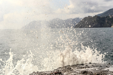 Big waves splashing over rocks