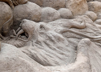 fragment of sand sculpture - lion head