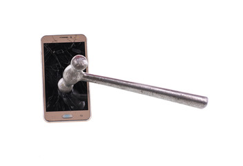 broken cell phone and hammer on white isolated background