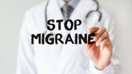 Doctor writing word Stop Migraine with marker, Medical concept
