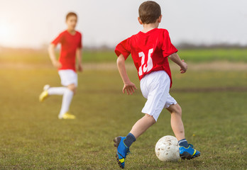 Young children player on the football match