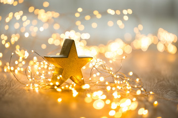 Christmas greeting card. Christmas stars decoration on bokeh background. New Year concept. Copy space.  