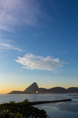 Naklejka na ściany i meble Beautiful panoramic view of the city of Rio de Janeiro with sugar loaf at dawn.