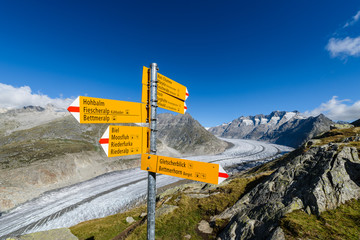 Wanderweg hiking trail pointer sign direction routs in Aletsch glacier area mountain view in Bettmeralp to Fiescheralp trail