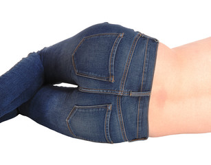 Close up of the butt of a woman lying in jeans