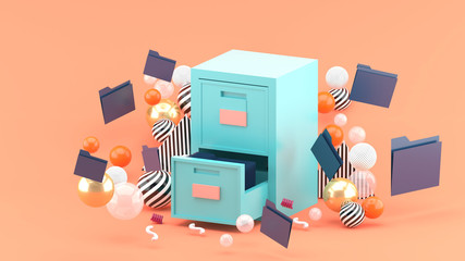 A document cabinet surrounded by colorful balls on a pink background.-3d rendering.