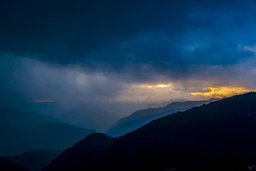 Sunrise over the Pir Panjal Range, clouds, raining, sunrise through the clouds, sunrise over the himalayas, rainy season