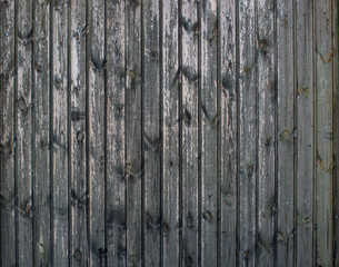 Grey vintage seamless wooden old planks background. Weathered cracked wall with peeling paint, abstract background.