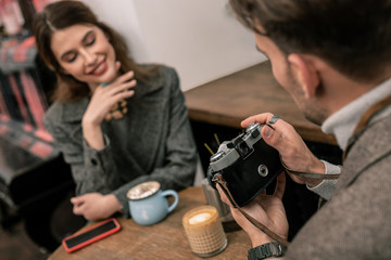 Man making film photos of his partner