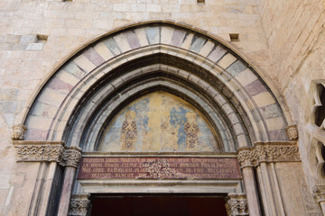 Fototapeta na wymiar painting the tympanum of portico in the south facade of Basilica of Sant Feliu in Girona, Catalonia, Spain