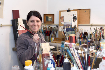 woman painting in a painting studio
