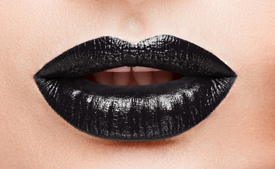 Female lips krubny plan, make-up black lipstick.