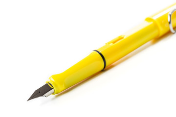yellow modern fountain pen isolated on white, close up