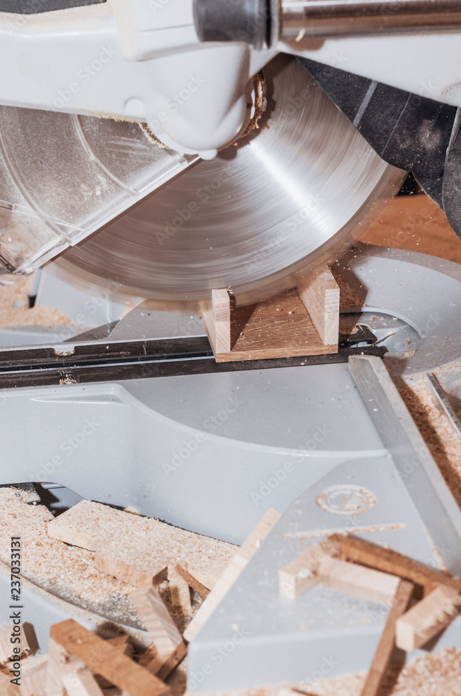 Canvas Prints circular saw cuts a wooden bar. carpentry workshop. work, employment, production.