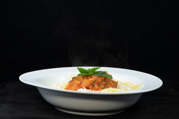 Spaghetti with fresh tomato and basil sauce and shredded halloumi