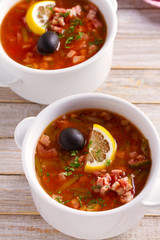 Traditional Russian dish  solyanka - thick, spicy and sour saltwort soup