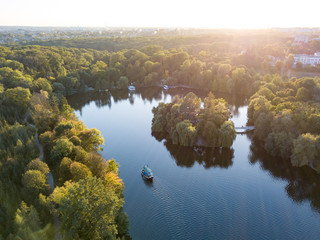 Beautiful countryside landscape picturesque river with ships, green forest with summer sky at...