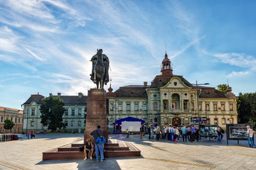 Zrenjanin, Serbia - May 17, 2018: Zrenjanin downtown, city architecture, urban landscape. Square of freedom with statue of King Petar Karadjordjevic the first and city hall.
