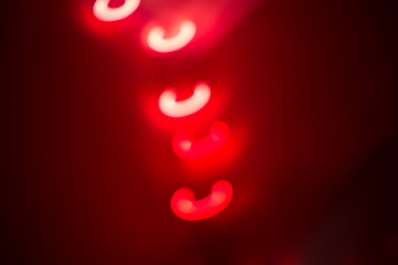 red blurred bokeh lights on red-brown background
