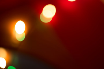 colorful bokeh lights on a red-brown background
