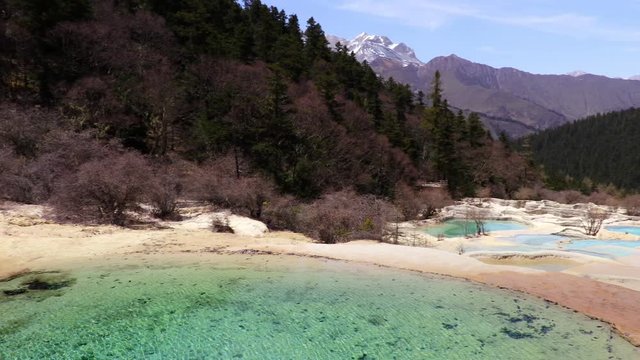 Travertine landscapes and pools of Huanglong (literally: yellow dragon), Sichuan, China. Huanglong was declared a World Heritage Site by UNESCO in 1992. 